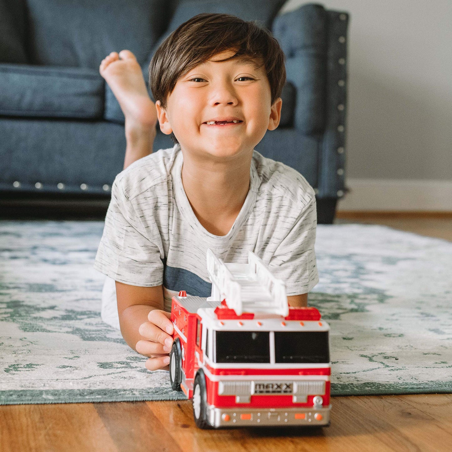 Sunny Days Entertainment Maxx Action 12’’ Large Fire Truck - Lights and Sounds Vehicle with Extendable Ladder | Motorized Drive and Soft Grip Tires |